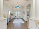 Elegant foyer with detailed ceilings, tile floors, and a view of the front door at 4607 Benito Ct, Bradenton, FL 34211