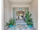 Inviting foyer with tile flooring, decorative plants, and a clear view of the open living area at 4607 Benito Ct, Bradenton, FL 34211