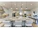 A spacious kitchen with a large center island, seating, and modern pendant lighting at 4607 Benito Ct, Bradenton, FL 34211