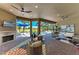 Relaxing covered patio with a view of the pool, golf course, and lush landscaping at 4607 Benito Ct, Bradenton, FL 34211