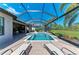 A stunning pool and hot tub with a screened-in lanai, a golf course view, plus patio seating at 4607 Benito Ct, Bradenton, FL 34211