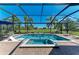 Screened-in pool and spa with brick patio, lounge chairs, and golf course views beyond at 4607 Benito Ct, Bradenton, FL 34211