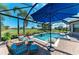 Screened-in pool area with a beautiful view of the golf course, featuring lounge chairs and patio furniture at 4607 Benito Ct, Bradenton, FL 34211