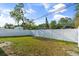 Spacious backyard with a well-maintained lawn and a long white fence at 5001 15Th N Ave, St Petersburg, FL 33710