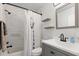 Renovated bathroom with new vanity, shower and bath combination, and stylish decor at 5001 15Th N Ave, St Petersburg, FL 33710