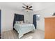 Cozy bedroom featuring a modern ceiling fan and laminate wood flooring at 5001 15Th N Ave, St Petersburg, FL 33710