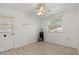 Bedroom featuring wood-look flooring and a water cooler next to a window at 5001 15Th N Ave, St Petersburg, FL 33710