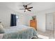Well-lit bedroom featuring modern ceiling fan and laminate wood flooring at 5001 15Th N Ave, St Petersburg, FL 33710