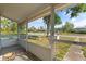 View from the screened-in front porch overlooking a neighborhood corner at 5001 15Th N Ave, St Petersburg, FL 33710