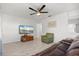 Open-concept living area featuring lots of natural light and laminate wood flooring at 5001 15Th N Ave, St Petersburg, FL 33710