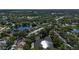 An aerial view of a beautiful community with tree-lined streets and shimmering lakes at 519 Catalina Isles Cir, Venice, FL 34292