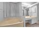 Bathroom featuring a large soaking tub and vanity at 519 Catalina Isles Cir, Venice, FL 34292