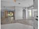 Open-concept living area with wood floors, modern lighting, and access to the lanai at 519 Catalina Isles Cir, Venice, FL 34292