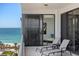 Outdoor balcony with furniture and ocean views at 545 Sanctuary Dr # B806, Longboat Key, FL 34228