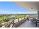 Enjoy panoramic views of the golf course and waterfront from the expansive balcony at 545 Sanctuary Dr # B806, Longboat Key, FL 34228