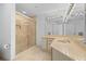 Elegant bathroom with frameless shower, custom vanity and marble tiling at 545 Sanctuary Dr # B806, Longboat Key, FL 34228