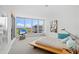 This bedroom has large windows with beautiful views and comfortable carpet at 545 Sanctuary Dr # B806, Longboat Key, FL 34228