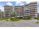 Luxury condominium complex featuring multi-story architecture, private balconies, and lush landscaping at 545 Sanctuary Dr # B806, Longboat Key, FL 34228