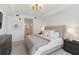 Comfortable main bedroom with ensuite bathroom, soft natural light, and modern decor at 5664 Palmer Cir # 102, Bradenton, FL 34211