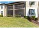 Enjoy the outdoors in this screened-in lanai overlooking a lush green space with tropical landscaping at 5664 Palmer Cir # 102, Bradenton, FL 34211