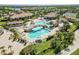 Resort-style pool area with ample lounge chairs and lush landscaping, perfect for relaxation and recreation at 5664 Palmer Cir # 102, Bradenton, FL 34211