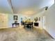 Open dining area with round table, decorative mirrors, and stylish decor at 5711 Garden Lakes Palm, Bradenton, FL 34203