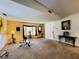 Spacious living room featuring a large bay window, neutral carpet and walls at 5711 Garden Lakes Palm, Bradenton, FL 34203