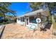 Pool house with chairs for lounging at 5711 Garden Lakes Palm, Bradenton, FL 34203
