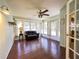 Bright sun room with hardwood floors, a ceiling fan, and lots of natural light at 5711 Garden Lakes Palm, Bradenton, FL 34203