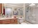 Bathroom featuring a vanity, toilet, and shower with glass door at 5934 Guarino Dr, Sarasota, FL 34238