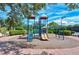 Colorful community playground with slides and climbing structures set on a safe, padded surface at 5934 Guarino Dr, Sarasota, FL 34238