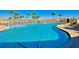 Large, inviting pool with plenty of lounge chairs and a beautiful view of the lake at 5934 Guarino Dr, Sarasota, FL 34238