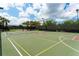 Well-maintained community basketball and tennis court with clear markings and professional equipment at 5934 Guarino Dr, Sarasota, FL 34238