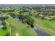 Picturesque golf course with water features, lush greenery, and scenic walking paths at 7507 Preserves Ct # 7507, Sarasota, FL 34243