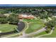 Scenic view of the golf course, clubhouse, and a tranquil pond with a fountain at 7507 Preserves Ct # 7507, Sarasota, FL 34243