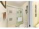 This bathroom features a glass-enclosed shower, a towel, and a toilet at 7507 Preserves Ct # 7507, Sarasota, FL 34243