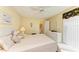 Bright bedroom with an open bathroom, comfortable bed, and natural light exposure at 7507 Preserves Ct # 7507, Sarasota, FL 34243