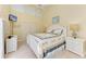 Well-lit bedroom with a ceiling fan and a coordinated bedding set and furniture at 7507 Preserves Ct # 7507, Sarasota, FL 34243