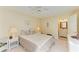 Inviting bedroom with a comfortable bed and ensuite bathroom access to the side at 7507 Preserves Ct # 7507, Sarasota, FL 34243