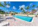 Enjoy the community pool with plenty of lounge chairs, shade, and a cabana on a sunny day at 7507 Preserves Ct # 7507, Sarasota, FL 34243
