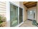 Outdoor entrance featuring a sliding door and glass paned front door with a side window at 7507 Preserves Ct # 7507, Sarasota, FL 34243