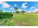 Beautiful golf course view with lush green grass, mature trees, and clear blue skies at 7507 Preserves Ct # 7507, Sarasota, FL 34243