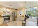 Open kitchen with granite countertops, stainless steel appliances, and a breakfast bar at 7507 Preserves Ct # 7507, Sarasota, FL 34243