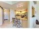 Kitchen featuring granite countertops, stainless steel appliances and breakfast bar at 7507 Preserves Ct # 7507, Sarasota, FL 34243