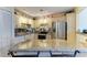 Kitchen with granite countertops, stainless steel appliances and breakfast bar at 7507 Preserves Ct # 7507, Sarasota, FL 34243