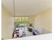 Open concept living room with large windows, a fireplace, and sliding glass doors to the outside at 7507 Preserves Ct # 7507, Sarasota, FL 34243