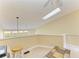 Bright living room with a skylight and a view from the second story at 7507 Preserves Ct # 7507, Sarasota, FL 34243