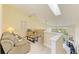 Loft area featuring a sitting area and views of the living room below at 7507 Preserves Ct # 7507, Sarasota, FL 34243