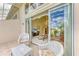 View from the screened-in patio looking into the home, with natural light and golf course views at 7507 Preserves Ct # 7507, Sarasota, FL 34243