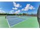 Tennis courts with multiple courts in green and blue with nets stretched across the court at 7507 Preserves Ct # 7507, Sarasota, FL 34243